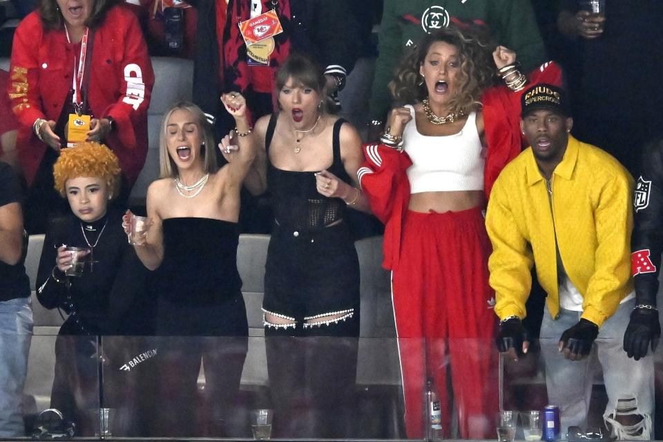 Ice Spice, from left, Ashley Avignone, Taylor Swift and Blake Lively react during the first half of the NFL Super Bowl 58 football game between the San Francisco 49ers and the Kansas City Chiefs on Sunday, Feb. 11, 2024, in Las Vegas. (AP Photo/David Becker)