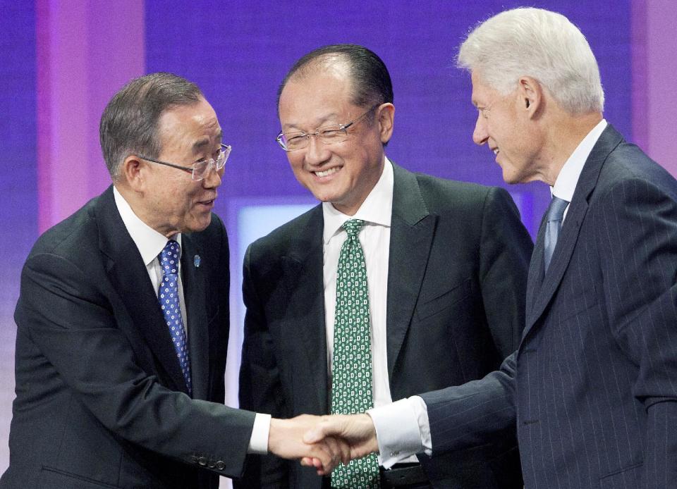 United Nations Secretary-General Ban Ki-Moon, left, shakes hands with former U.S. President Bill Clinton after they participated in a panel discussion with World Bank President Jim Yong Kim, center, at the Clinton Global Initiative in New York on Sunday, Sept. 23, 2012. (AP Photo/Mark Lennihan)