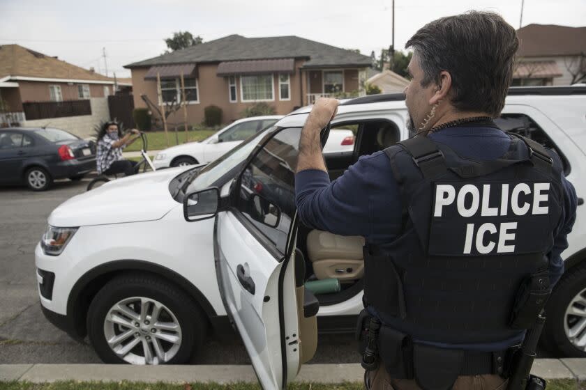 A Immigration and Customs Enforcement fugitive operations team member Jorge Field outside a Montebello home