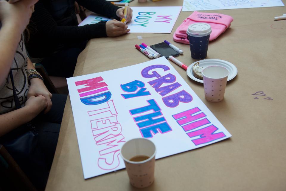 Marchers make signs at women's co-working space and social club, The Wing.People march in Manhattan during the 2018 Women&rsquo;s March on New York City on Jan. 20, 2018.&nbsp;&nbsp;