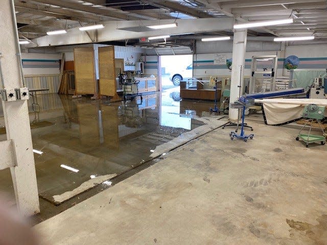 Flood water from a monsoon rain covers the floor at the poultry barn at McGee Park on July 29, 2022.