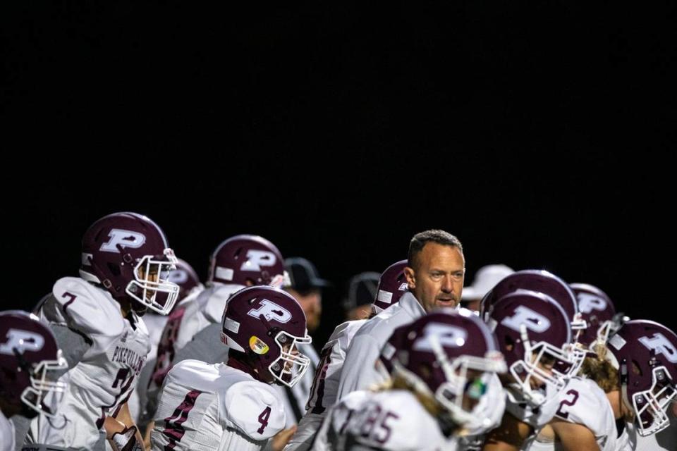 Pikeville Panthers head coach Chris McNamee watches as his players take the field to warm up before a game at Daniel Field in Hazard, Ky., on Friday, Oct. 22, 2021. Pikeville won, 17-0.