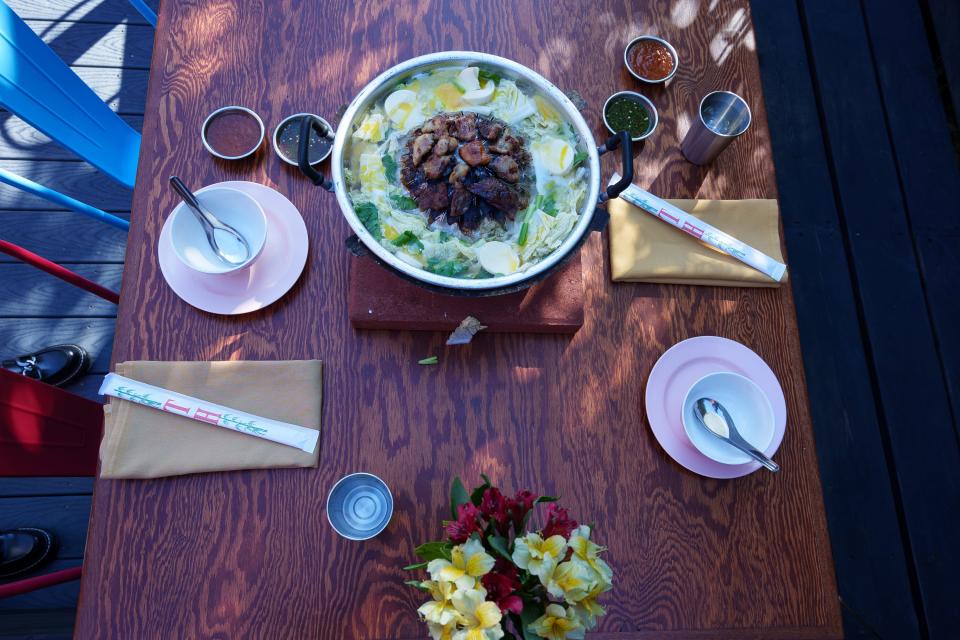 A table is set for the family-style Thai barbecue food that is served at Mr. Baan's Bar and Mookata in Phoenix.