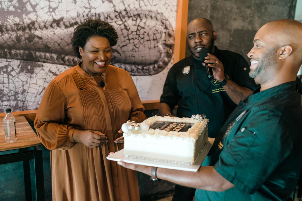 David Wilmott and Darnell Morgan with Stacey Abrams