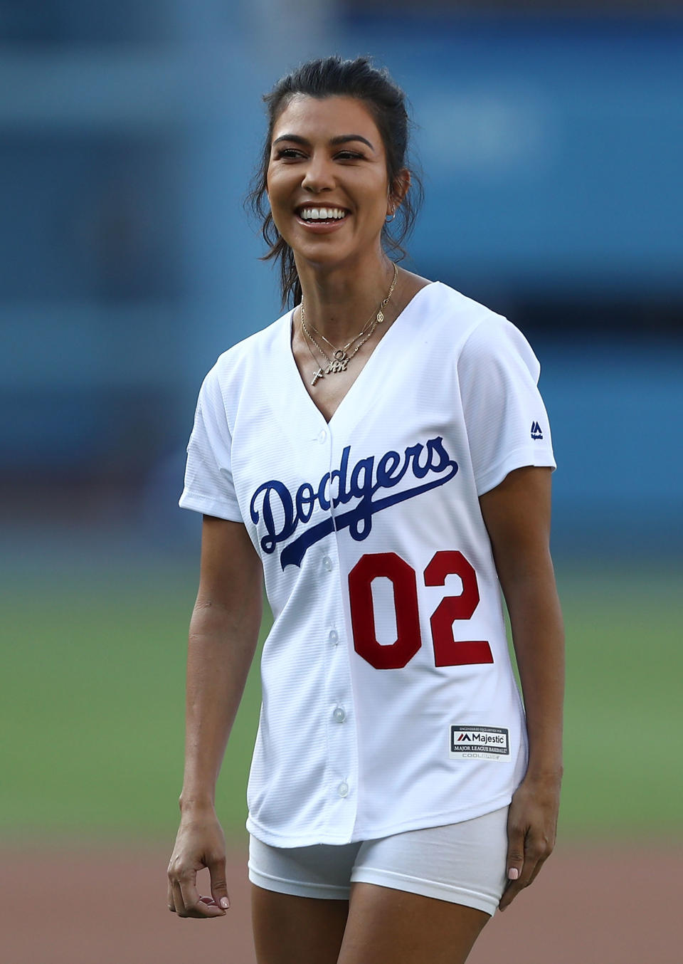 LOS ANGELES, CA - AUGUST 02:  Kourtney Kardashian looks on after throwing out the ceremonial first pitch prior to the MLB game at Dodger Stadium on August 2, 2018 in Los Angeles, California. The Dodgers defeated the Brewers 21-5.  (Photo by Victor Decolongon/Getty Images)