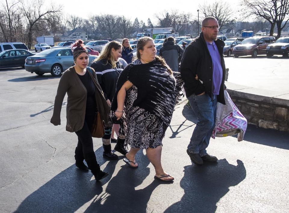 Mourners arrive for a memorial service Monday, Jan. 16, 2017, for GracePacker, the local teen who who authorities say was killed and dismembered by her adoptive mother and her boyfriend, at the New Life Presbyterian Church in Glenside, Pa. (Ed Hille/The Philadelphia Inquirer via AP)
