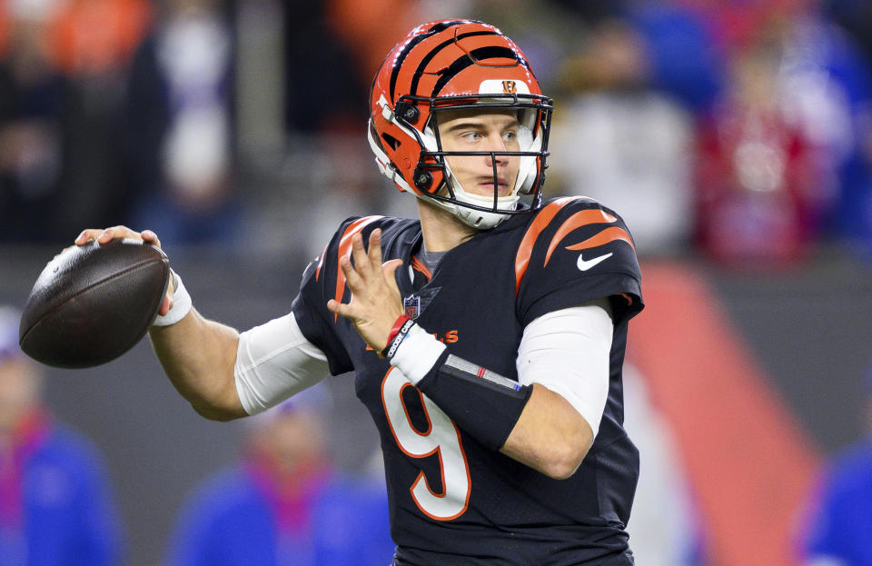 FILE - Cincinnati Bengals quarterback Joe Burrow (9) throws downfield during an NFL football game against the Buffalo Bills, Sunday, Nov. 5, 2023, in Cincinnati. The success stories are the reason why teams keep coming back hoping to get their franchise-lifting quarterback success story like Patrick Mahomes, Josh Allen, Lamar Jackson or Joe Burrow.(AP Photo/Zach Bolinger, File)