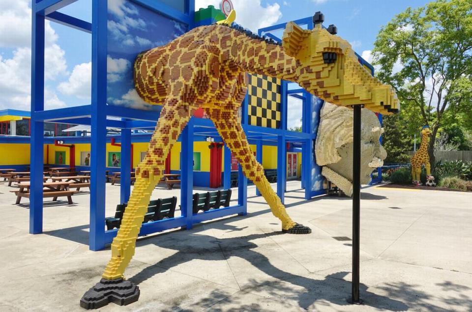 A giant giraffe built out of LEGO bricks greets visitors at the entryway of the Legoland Florida Resort theme park in Orlando, Fla.