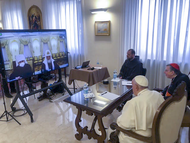 Pope Francis, with Cardinal Kurt Koch, prefect of the Vatican’s Pontifical Council for Promoting Christian Unity, right, and a translator attend a video call with Patriarch Kirill, at right on the monitor, and Metropolitan Hilarion, Wednesday, March 16, 2022. Pope Francis hasn’t made much of a diplomatic mark in Russia’s war in Ukraine as his appeals for an Orthodox Easter truce went unheeded and a planned meeting with the head of the Russian Orthodox Church was canceled. (Vatican Media via AP)