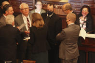 Members of the Kansas Senate's Rules Committee confer during a debate on a bill that would ban transgender students from girls' and women's school sports at the Statehouse, Wednesday, March 17, 2021, in Topeka, Kan. (AP Photo/John Hanna)