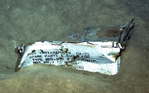 his undated image from a remotely operated underwater vehicle courtesy of Paul G. Allen, shows a spare parts box from the USS Indianapolis on the floor of the North Pacific Ocean. - Credit: Courtesy of Paul G. Allen