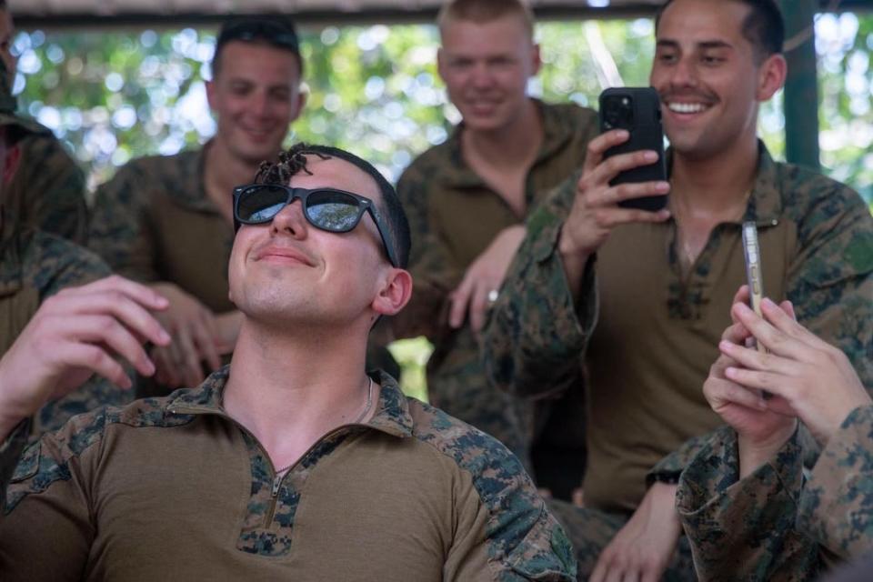 A spider walks across the face of a US Marine