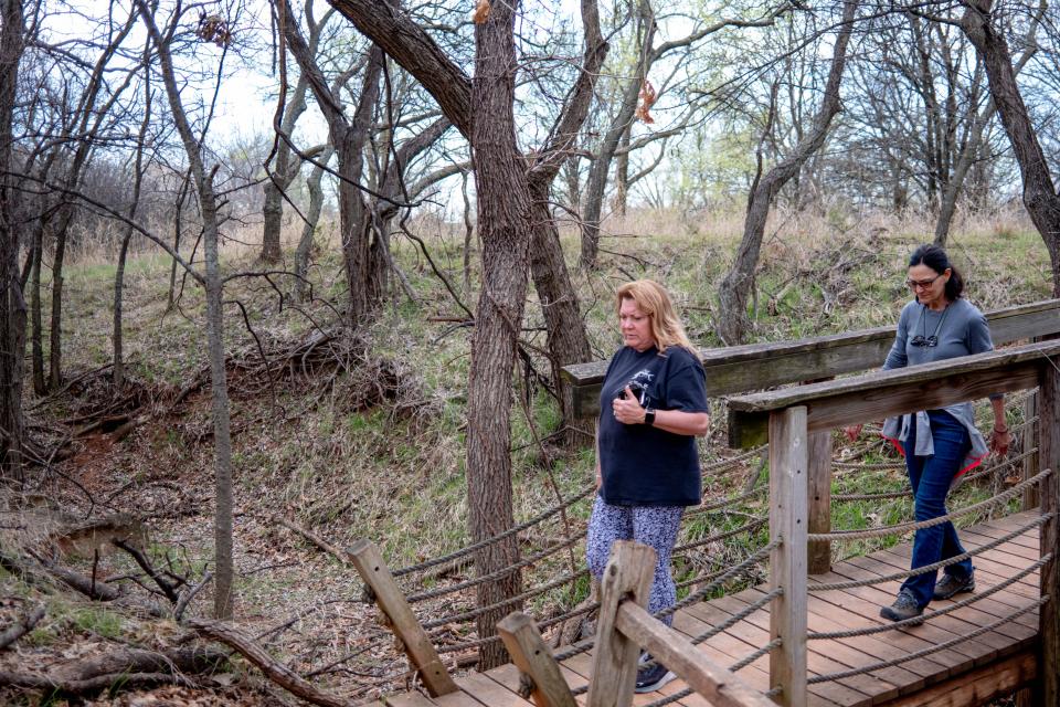 Paula Lane and Janice Ayers walk trails Wednesday at Martin Park.