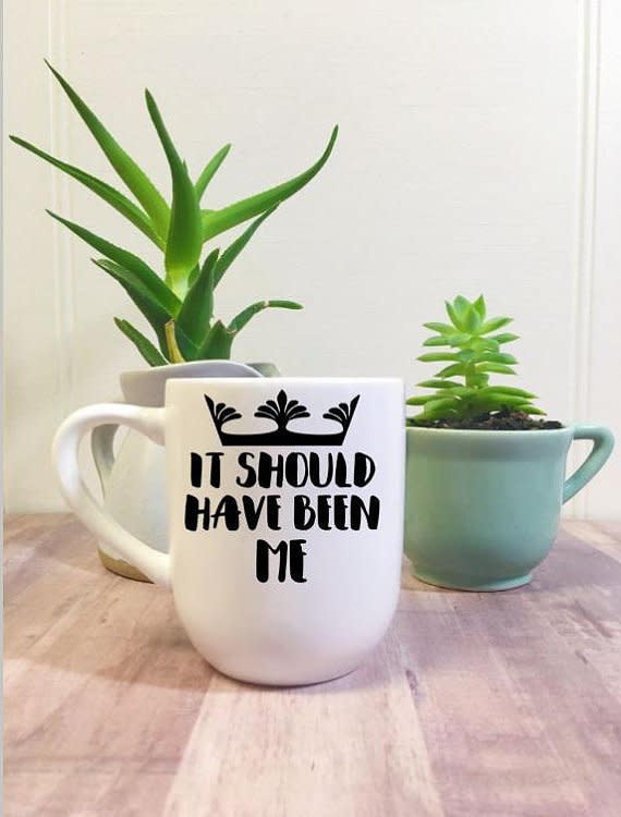 Get it <a href="https://www.etsy.com/listing/612396559/it-should-have-been-me-coffee-mug-royal" target="_blank">here</a>.&nbsp;