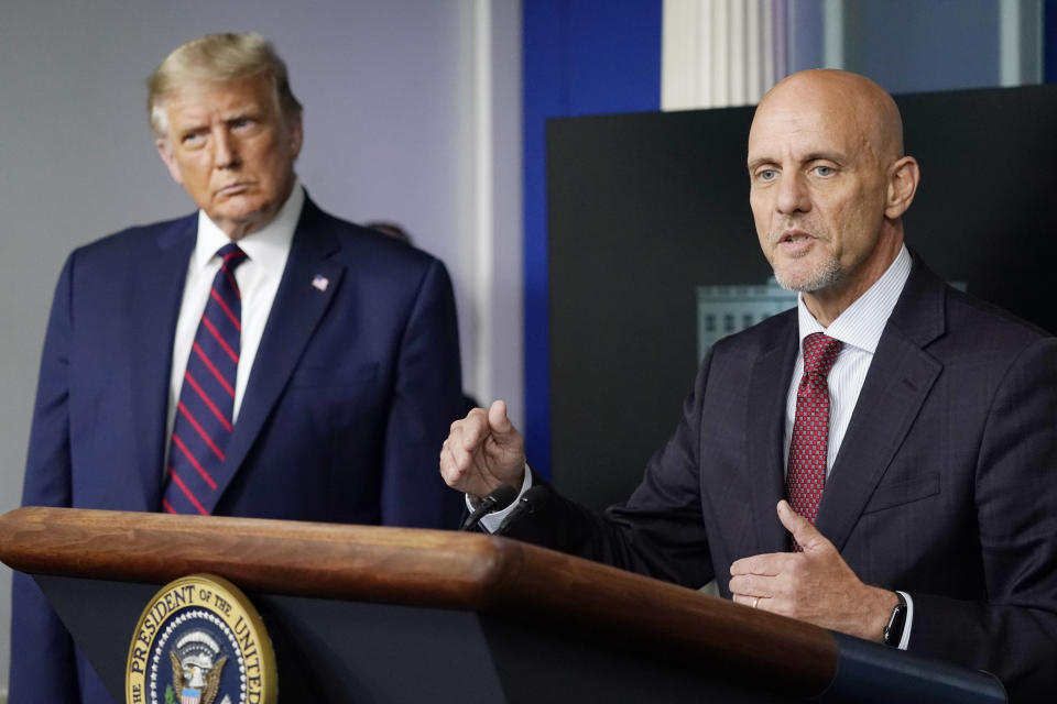 President Donald Trump listens as Dr. Stephen Hahn, commissioner of the U.S. Food and Drug Administration, speaks during a media briefing in the James Brady Briefing Room of the White House in Washington on August 23, 2020. (Alex Brandon/AP)