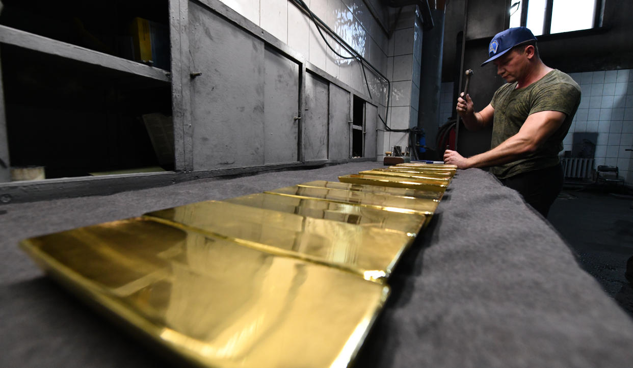 NOVOSIBIRSK, RUSSIA - SEPTEMBER 15: A worker casts ingots of 99.99 percent pure gold at Novosibirsk Refining Plant, Russia's leading gold refining and bar manufacturing plant, in Novosibirsk, Russia on September 15, 2023. The Novosibirsk Refining Plant stands as a prominent refining enterprise in Russia, specializing in the processing of both mineral and secondary raw materials enriched with precious metals. This facility is dedicated to the production of refined gold, silver, and various other precious metals, offering them in diverse forms such as ingots, granules, powder, and more. It also holds the esteemed status of Good Delivery among the six refineries in the Russian Federation. (Photo by Alexander Manzyuk/Anadolu Agency via Getty Images)