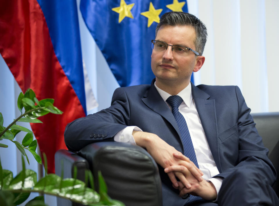 Slovenia's prime minister Marjan Sarec listens to reporter's question during an interview with the Associated Press in Ljubljana, Slovenia, Tuesday, April 23, 2019. (AP Photo/Darko Bandic)