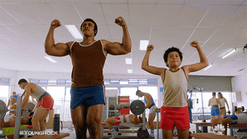 The young Rock showing his muscles in "Young Rock"