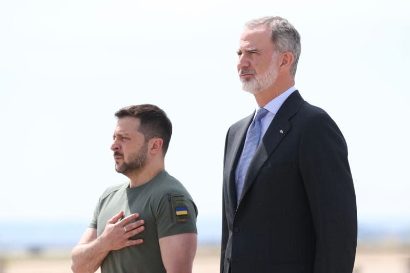 Spanish King Felipe VI (L) receives President of Ukraine Volodimir Zelensky (R) after arriving at Adolfo Suarez Madrid-Barajas Airport.  This is Zelensky's first official visit to Spain, and after his arrival he will meet the Prime Minister at La Moncloa Palace, where he will sign a security agreement.  Casa De SM El Rey/EUROPA PRESS/dpa