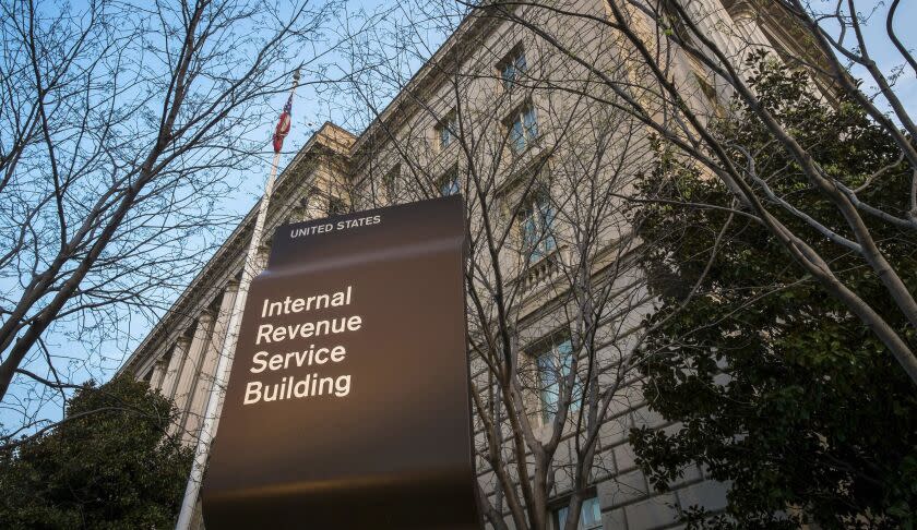 FILE - This April 13, 2014, file photo, shows the Internal Revenue Service headquarters building in Washington. A federal judge says it's likely that Microsoft was trying to avoid or evade paying U.S. taxes and is ordering the company to hand over financial documents from more than a decade ago. (AP Photo/J. David Ake, File)