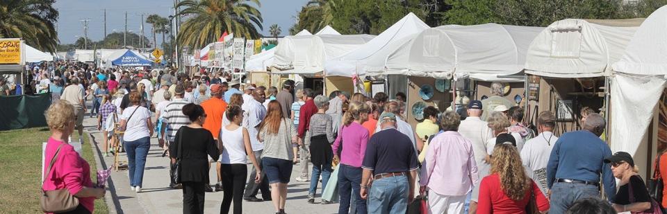 Visitors check out the artists' booths at a previous IMAGES Art Festival.