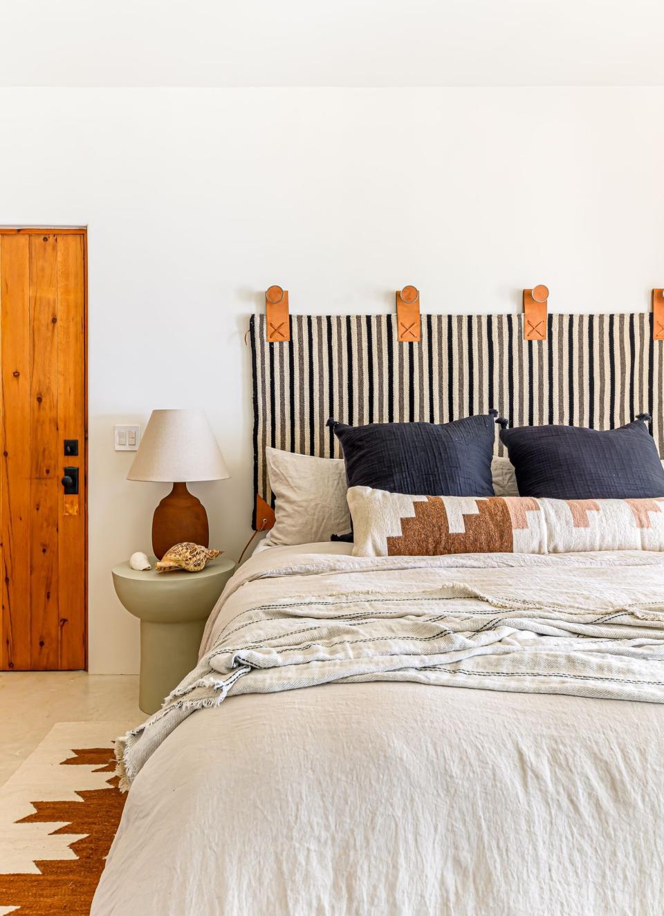 Boho bedroom with poured concrete flooring