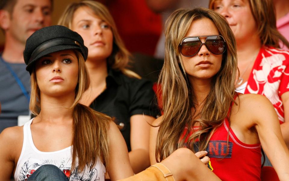 The infamous picture: Cheryl Cole and Victoria Beckham at the England vs Trinidad & Tobago match, 2006