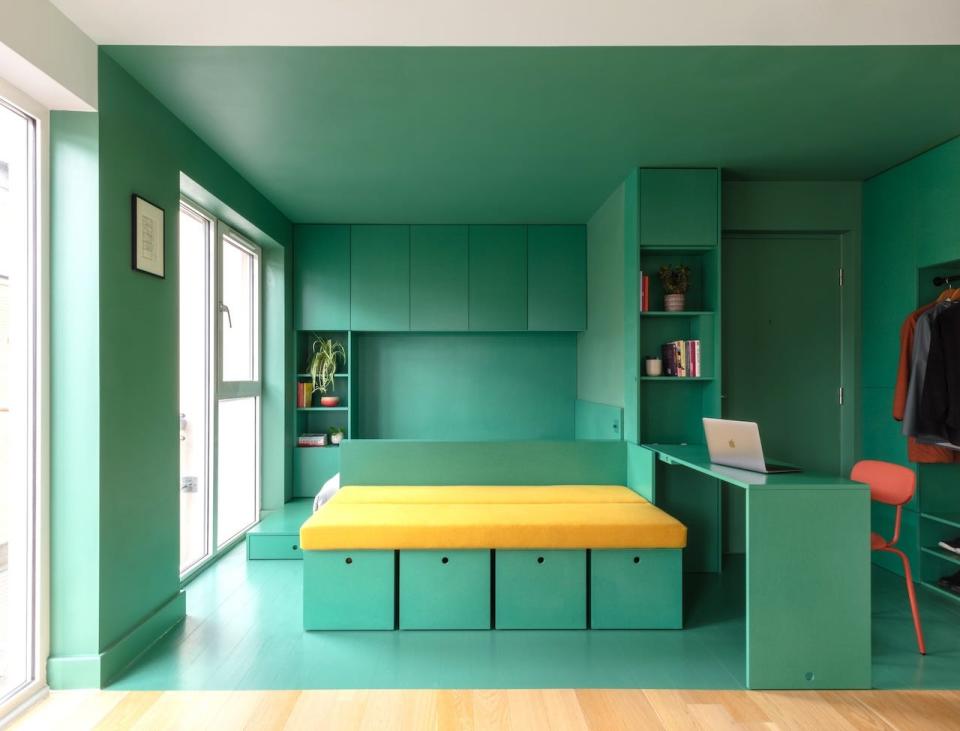 A green studio apartment in London.