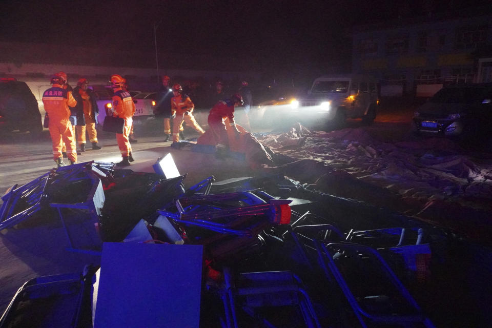 In this photo released by Xinhua News Agency, rescuers prepare for operation in the aftermath of an earthquake in Chenjia Village in Jishishan Bao'an, Dongxiang, Sala Autonomous County of Linxia Hui Autonomous Prefecture, northwest China's Gansu Province, Dec. 19, 2023. At least 100 people were killed in a magnitude 6.2 earthquake in a cold and mountainous region in northwestern China, the country's state media reported on Tuesday. (Ma Xiping/Xinhua via AP)