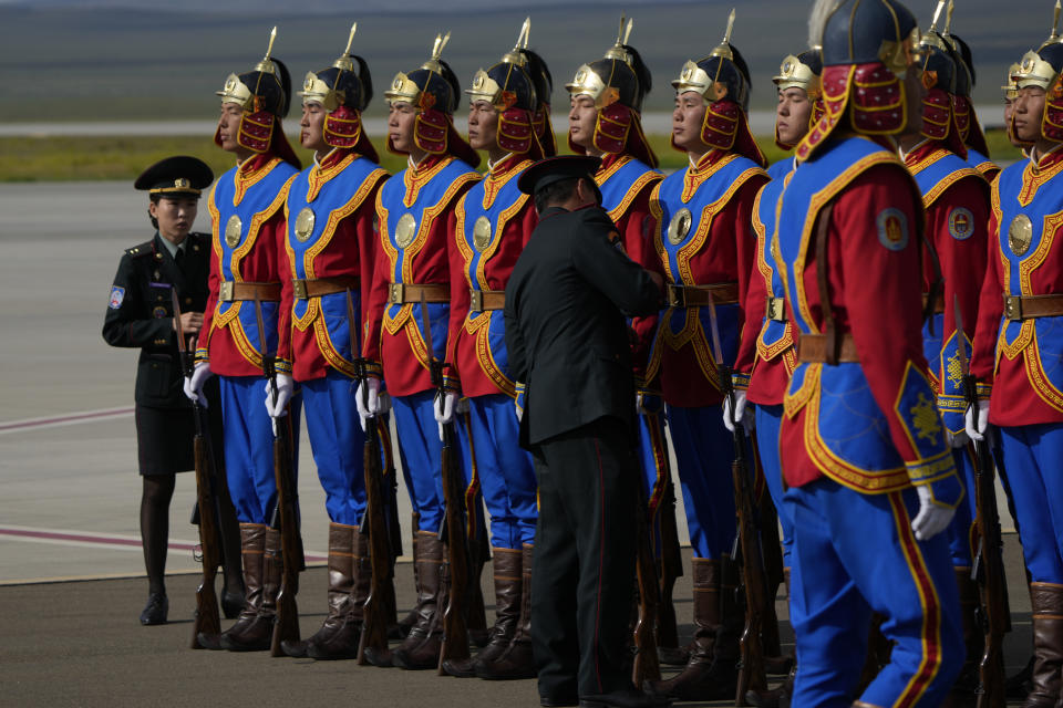 The Mongolian honor guard lines up the Ulaanbaatar's International airport Chinggis Khaan, Friday, Sept. 1, 2023. Pope Francis is traveling to Mongolia to encourage one of the world's smallest and newest Catholic communities. It's the first time a pope has visited the Asian country and comes at a time when the Vatican's relations with Mongolia's two powerful neighbors, Russia and China, are once again strained. (AP Photo/Ng Han Guan)