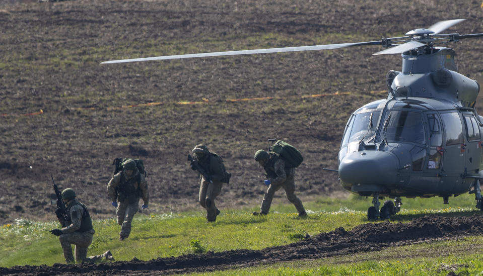 Lithuanian Army soldiers take part in a Lithuanian-Polish Brave Griffin 24/II military exercise near the Suwalki Gap near the Polish border at the Dirmiskes village, Alytus district west of the capital Vilnius in Lithuania on Friday, April 26, 2024. Over 1500 troops and 200 pieces of tactical equipment are rehearsing defence scenarios under the bilateral Lithuanian-Polish Orsha Plan near the Suwalki Gap. (AP Photo/Mindaugas Kulbis)