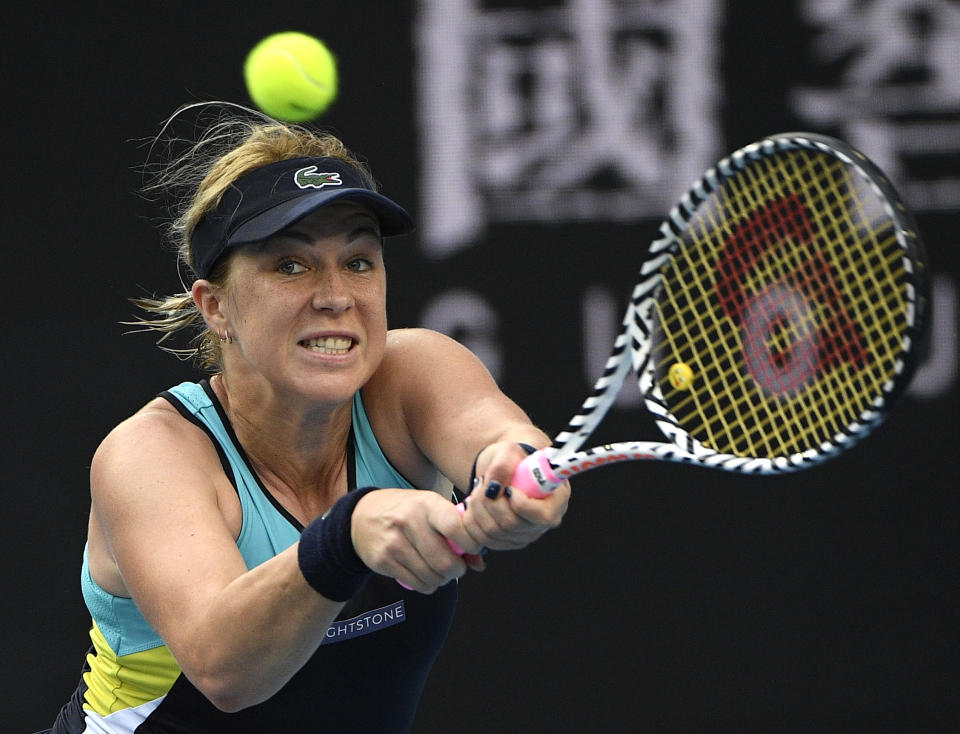 Russia's Anastasia Pavlyuchenkova makes a backhand return to Germany's Angelique Kerber during their fourth round singles match at the Australian Open tennis championship in Melbourne, Australia, Monday, Jan. 27, 2020. (AP Photo/Andy Brownbill)