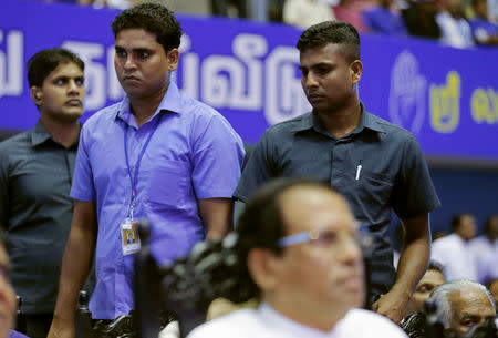 President's Security Division officers stand guard as Sri Lanka's President Maithripala Sirisena looks on during a special party convention in Colombo, Sri Lanka December 4, 2018. REUTERS/Dinuka Liyanawatte