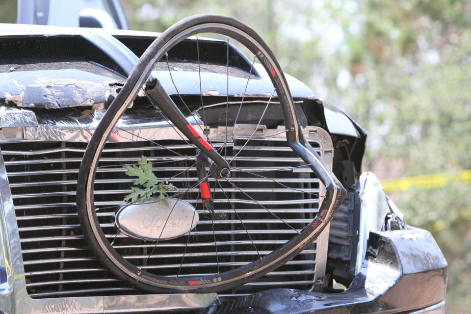 In this Saturday, June 19, 2021, photo courtesy of The White Mountain Independent is a pick up truck which ran over a group of cyclists in Show Low, Ariz. Police say a driver in a pickup truck has plowed into bicyclists competing in a community road race in Arizona, critically injuring several riders. Authorities say officers then chased down the driver Saturday and shot him outside a nearby hardware store. Police say six cyclists have been taken to a hospital in critical condition after the crash. (Jim Headley/The White Mountain Independent via AP)