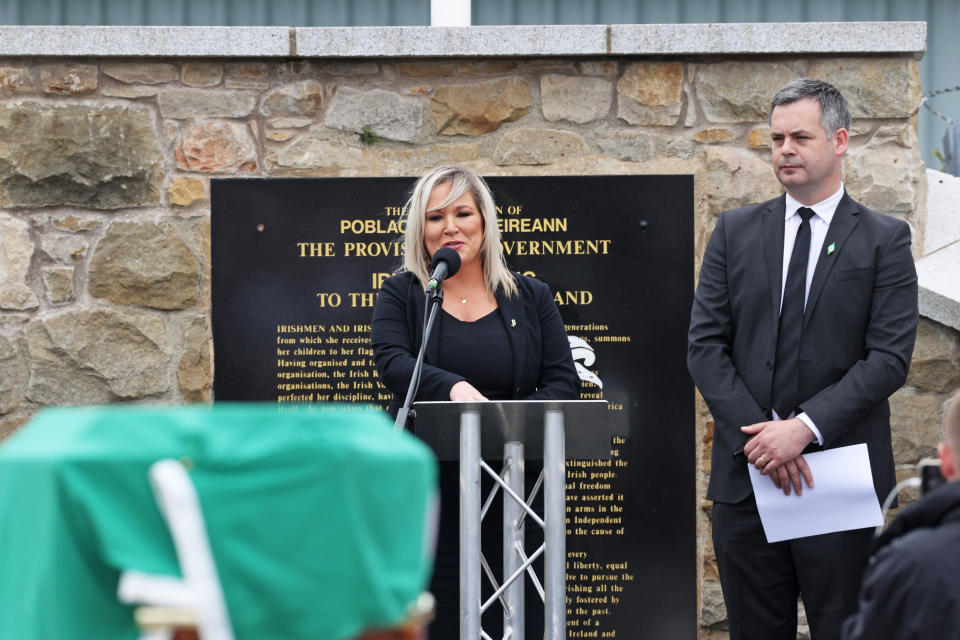 Deputy First Minister Michelle O'Neill speaks alongside Sinn Fein TD Pearse Doherty during the funeral of senior Irish Republican and former leading IRA figure Bobby Storey at Milltown Cemetery in west Belfast. (Photo by Liam McBurney/PA Images via Getty Images)