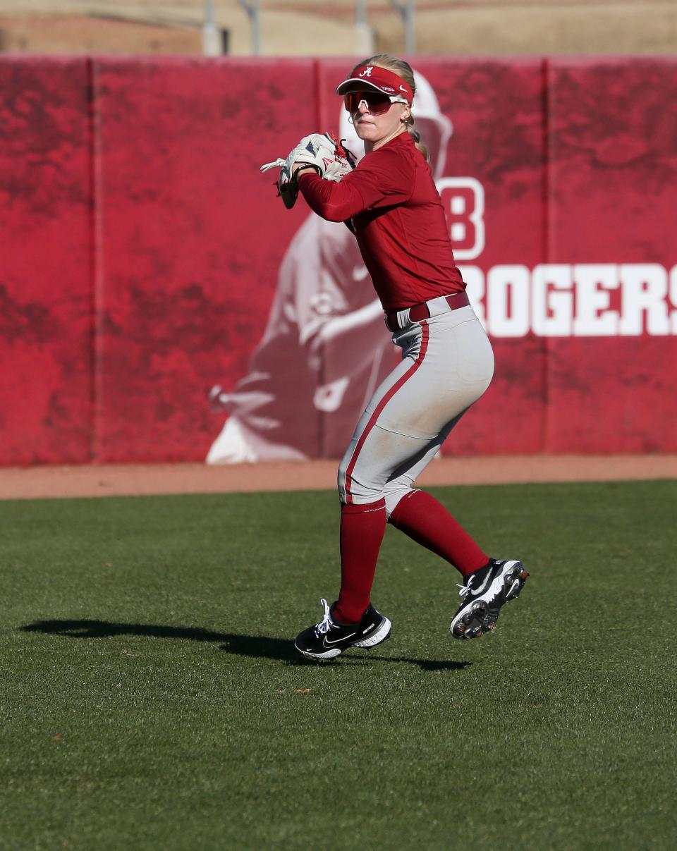 The Alabama softball team works out Wednesday, Feb. 9, 2022, as they prepare for a season-opening trip to Arizona. Dallis Goodnight makes a play on a ball in the outfield. 
