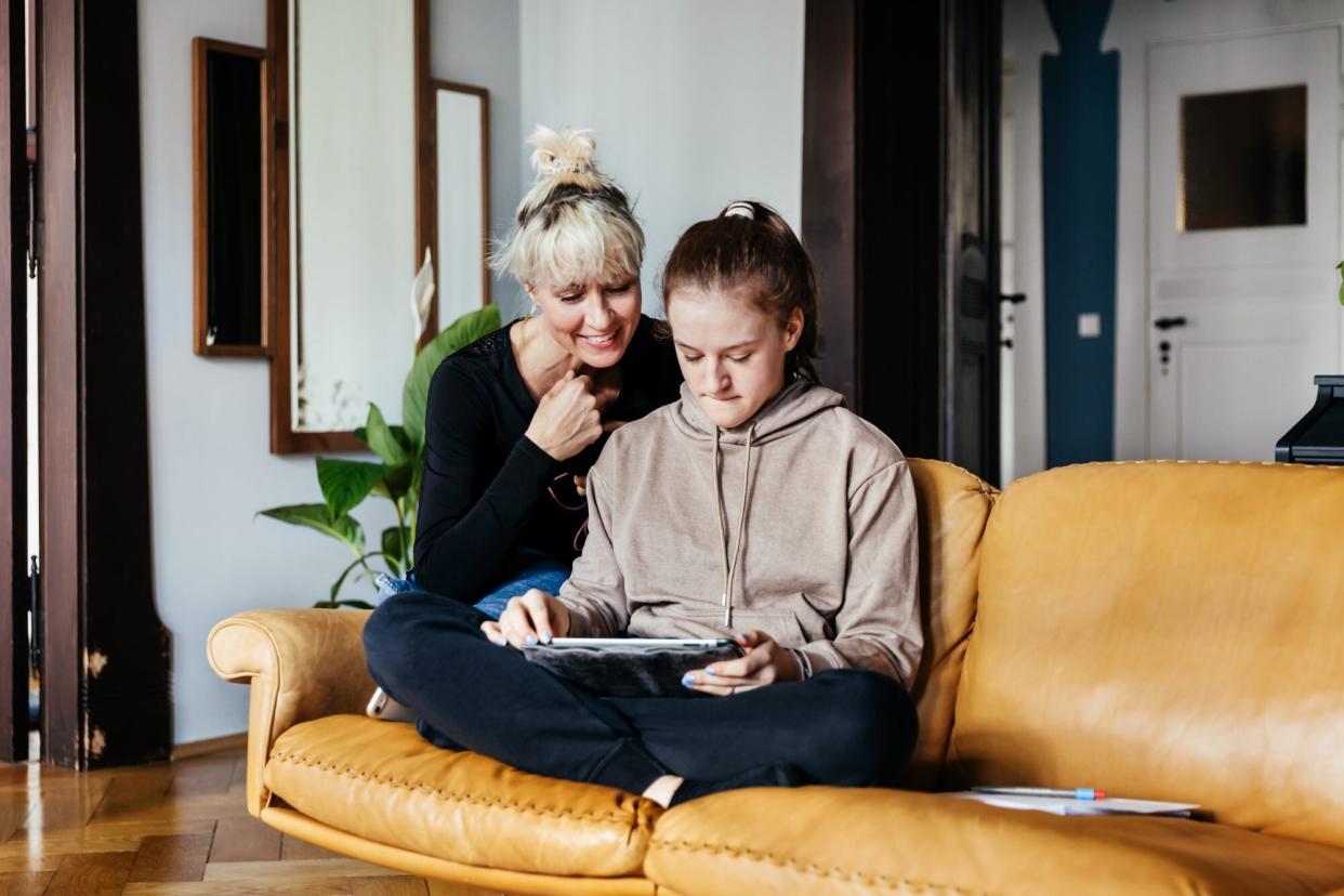 Mom helping teenager with homeowrk