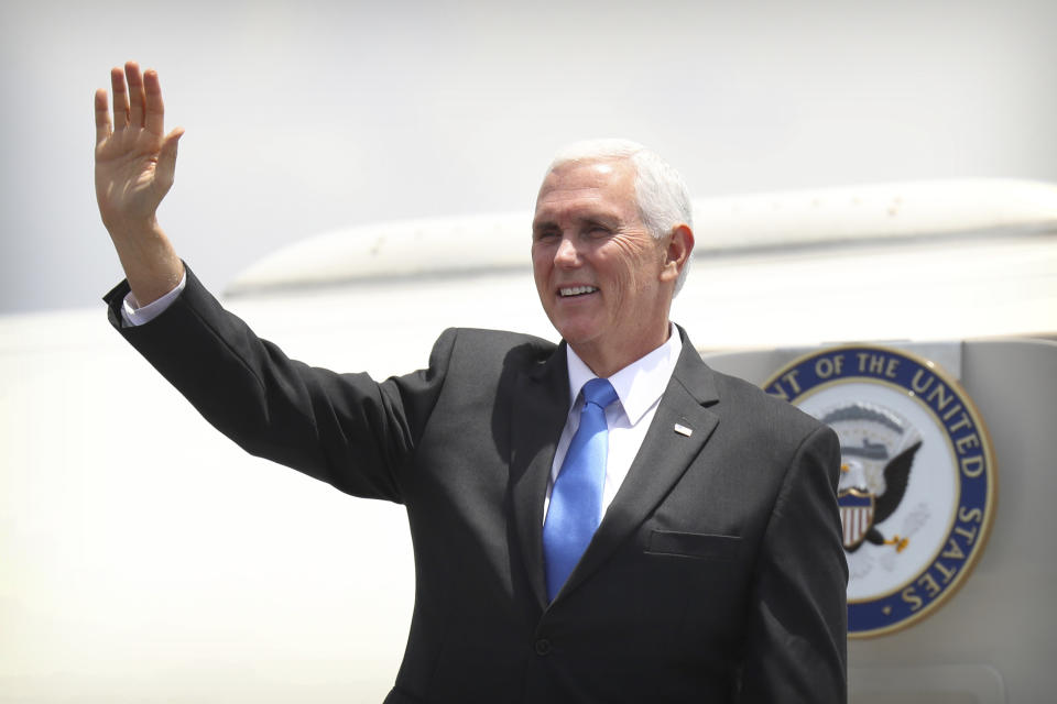 U.S. Vice President Mike Pence waves as he arrives at Jacksons International Airport in Port Moresby, Papua New Guinea, Saturday, Nov. 17, 2018. (AP Photo/Mark Schiefelbein)