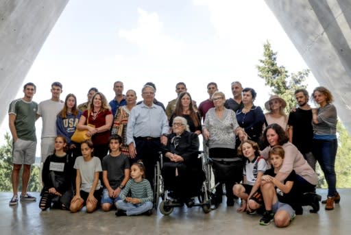 Melpomeni Dina Gianopoulou poses with the children and grandchildren of the Mordechai siblings her family hid from Nazis during World War II in Greece