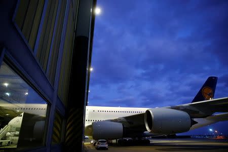 An A380 aircraft stands half inside a hanger at the Lufthansa Technik facility in Frankfurt, Germany November 18, 2015. REUTERS/Kai Pfaffenbach