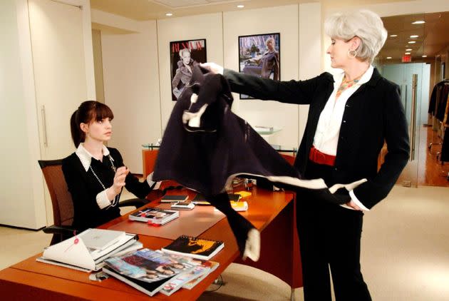 Miranda Priestly was the queen of microaggressions, like throwing her coat on her assistant's desk. (Photo: Alamy Stock Photo)