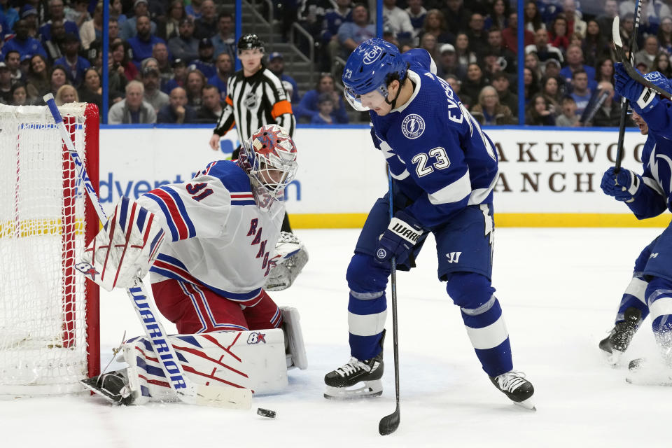 New York Rangers goaltender Igor Shesterkin (31) makes a save on a shot by Tampa Bay Lightning center Michael Eyssimont (23) during the second period of an NHL hockey game Saturday, Dec. 30, 2023, in Tampa, Fla. (AP Photo/Chris O'Meara)