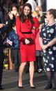 <p>The Duchess wears a bright red Luisa Spagnoli peplum skirt suit with black heeled pumps and a matching clutch a a Place2Be assembly in London. </p>