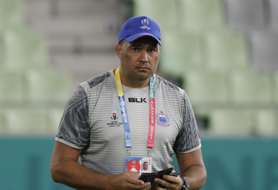 Samoa's rugby team coach Steve Jackson watches during their training at the Kobe Misaki Stadium in Kobe, Japan, Sunday, Sept. 29, 2019. Samoa will play against Scotland tomorrow in their Pool A game.(AP Photo/Aaron Favila)