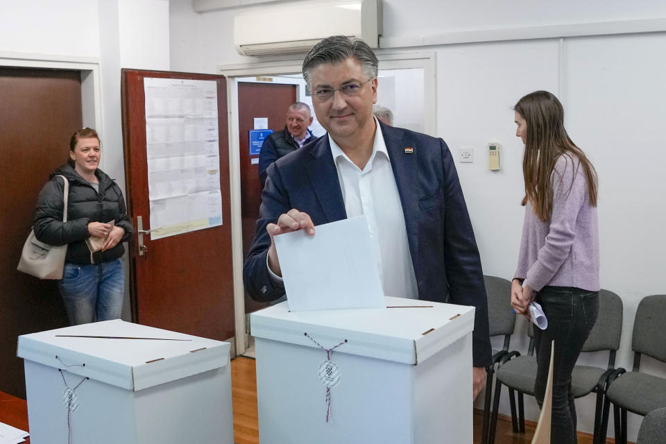 Prime Minister incumbent Andrej Plenkovic casts his ballot at a polling station in Zagreb, Croatia, Wednesday, April 17, 2024. Croatia is voting in a parliamentary election after a campaign that centered on a bitter rivalry between the president and prime minister of the small European Union and NATO member. (AP Photo/Darko Vojinovic)