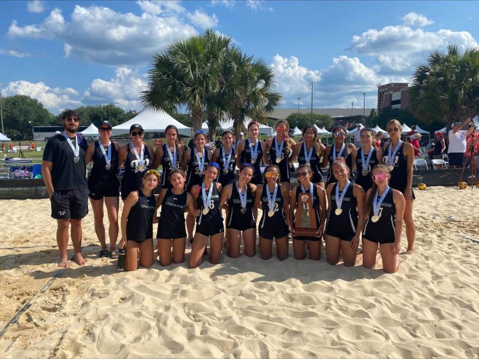 The Westminster Christian beach volleyball team poses with the state runner-up trophy on Saturday in Tallahassee after losing in the state final against New Smyrna Beach.