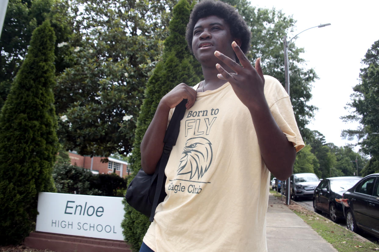 Graduating senior from Enloe High School Malika Mobley has concerns about proposed increases in police presence in schools following the recent Texas school shooting, Thursday, June 3, 2022, in Raleigh, N.C. To reassure students and educators following the mass shooting at a Texas elementary school, districts around the country pledged to boost security measures and increased the presence of law enforcement on campus. (AP Photo/Chris Seward)