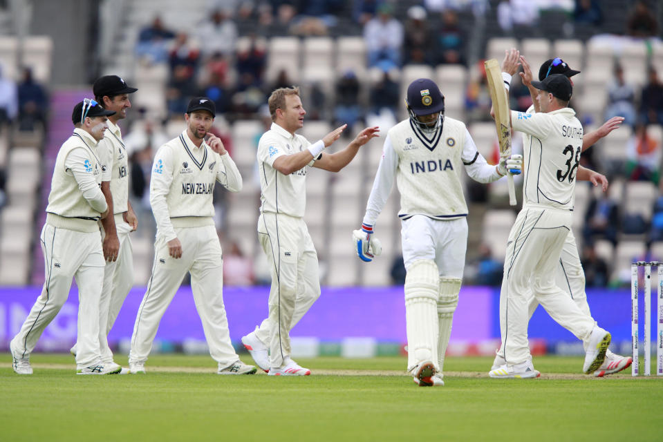 New Zealand's Neil Wagner, fourth left, celebrates with teammates the dismissal of India's Shubman Gill, third right, during the second day of the World Test Championship final cricket match between New Zealand and India, at the Rose Bowl in Southampton, England, Saturday, June 19, 2021. (AP Photo/Ian Walton)