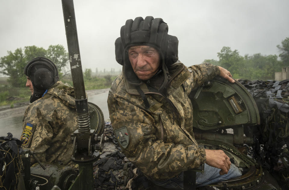 Ukrainian soldiers on a tank ride along the road towards their positions near Bakhmut, Donetsk region, Ukraine, Tuesday, May 23, 2023.(AP Photo/Efrem Lukatsky)