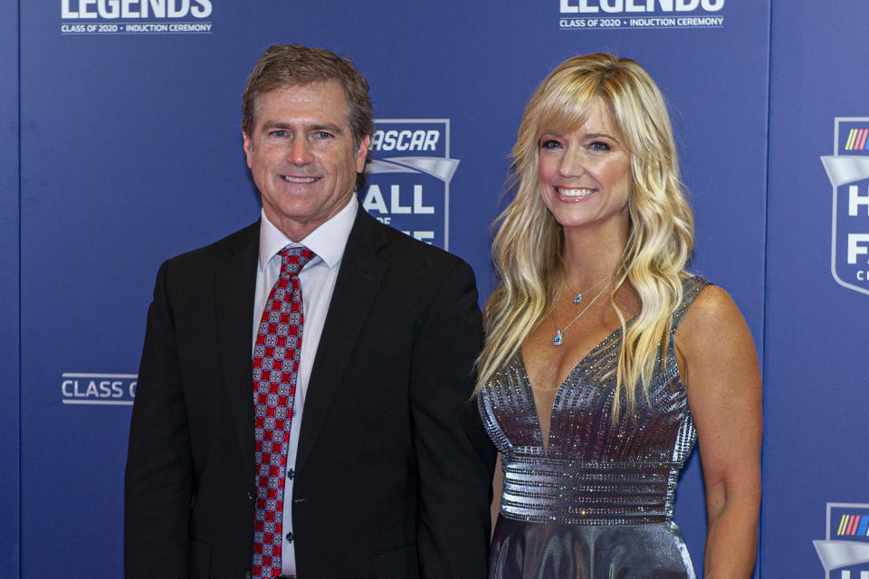 NASCAR Hall of Fame inductee Bobby Labonte along with his wife, Kristin, poses for pictures prior to the induction ceremony in Charlotte, N.C., Friday, Jan. 31, 2020. (AP Photo/Mike McCarn)